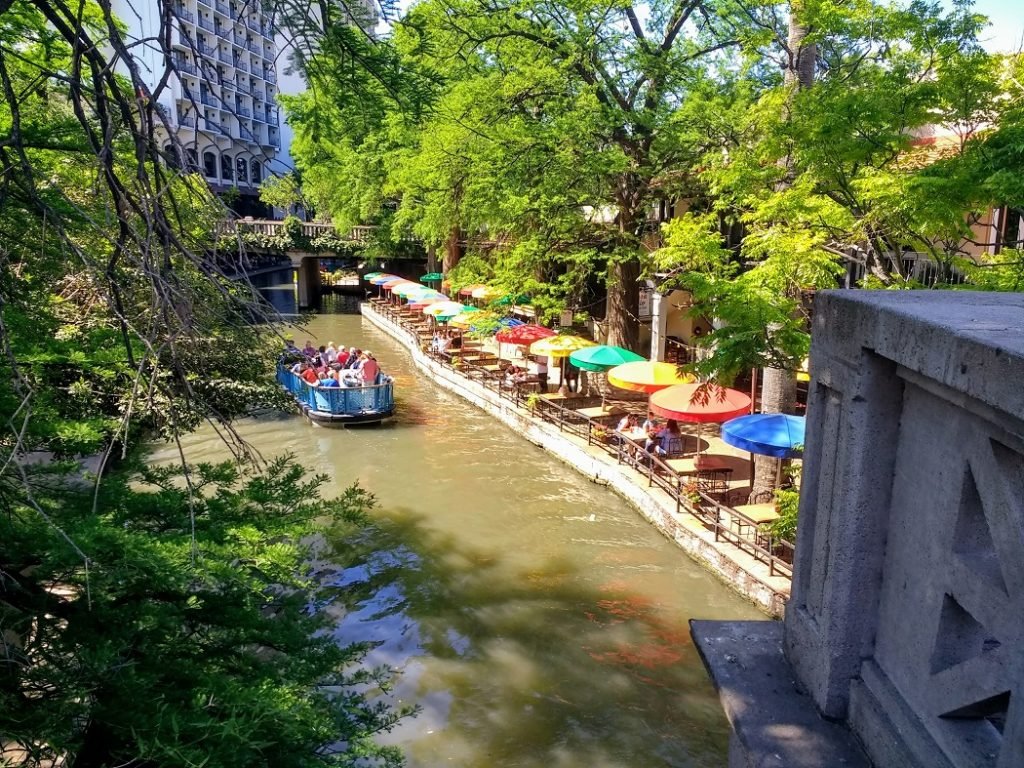 diners shaded by umbrellas at Riverwalk