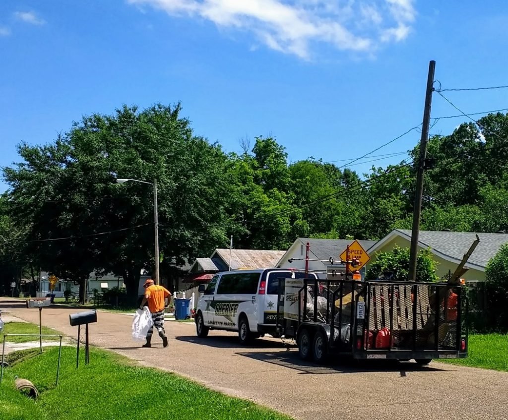 Lafayette Parish Sheriff prisoner cleaning up trash
