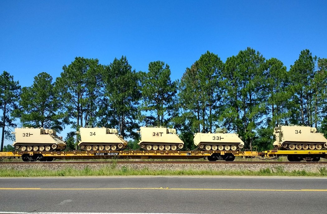 Army tanks riding on a train. Are these Trump’s tanks?